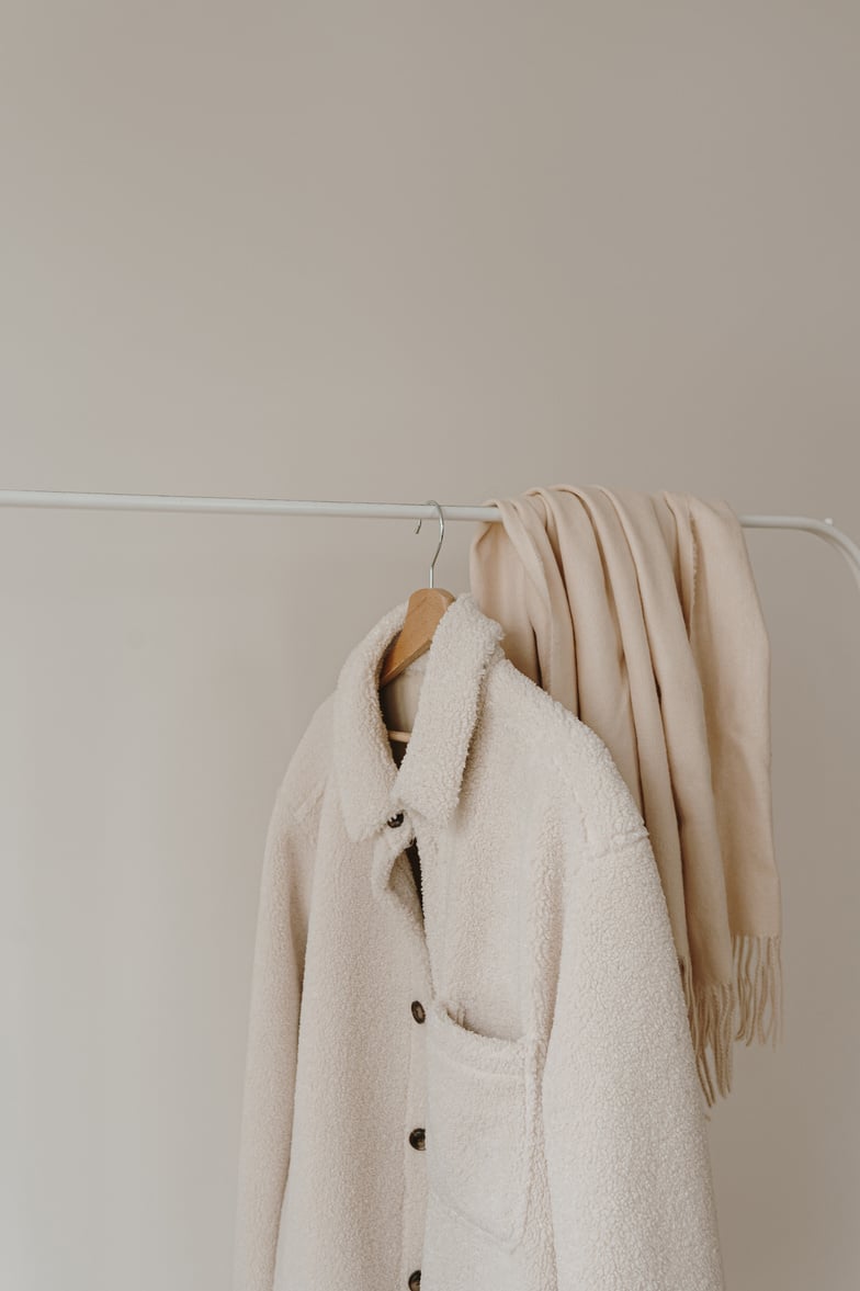 Scarf and Jacket Hanging on a Rack